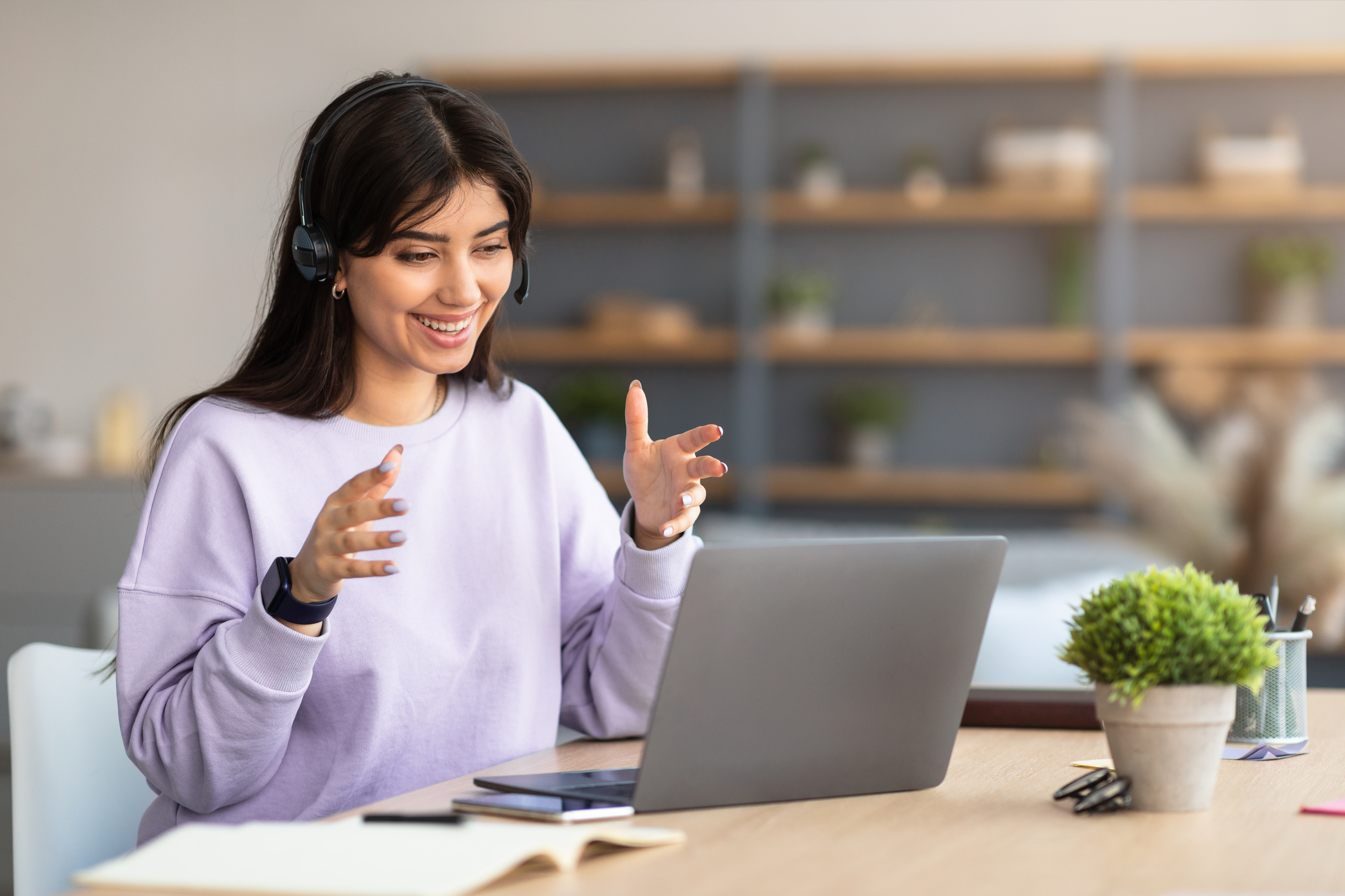 woman-having-video-call-using-laptop-and-talking-2021-09-02-07-21-36-utc